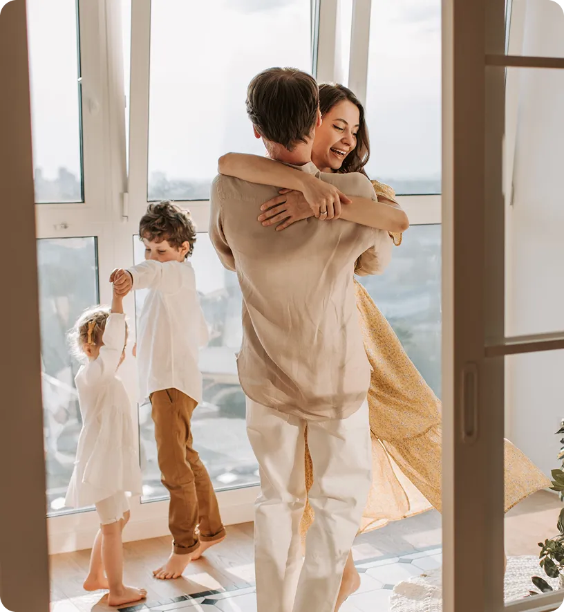 Family hugging while traveling