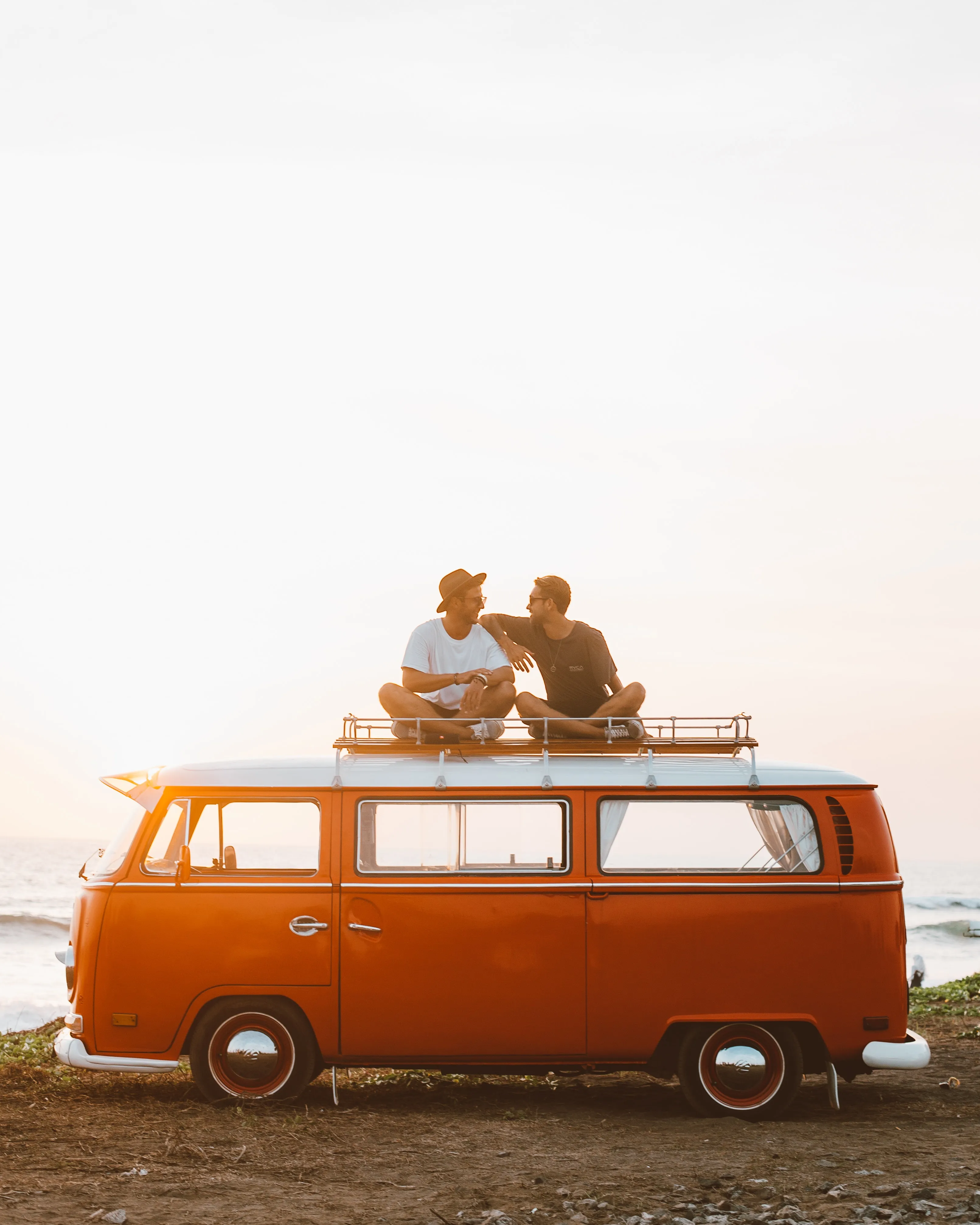 Friends on top of a van